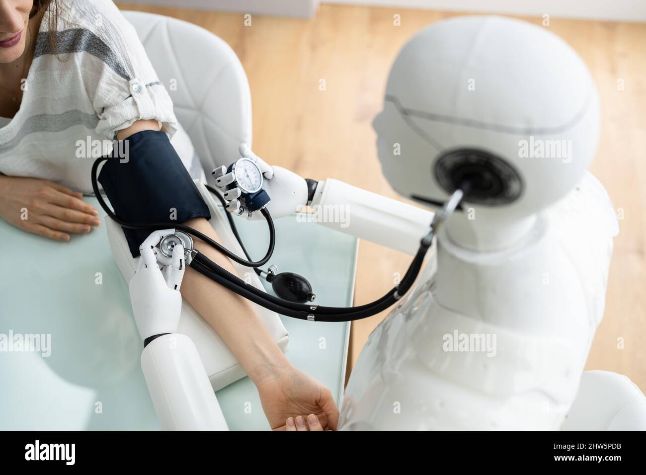 Blood Pressure Health Check By Robot Doctor Stock Photo
