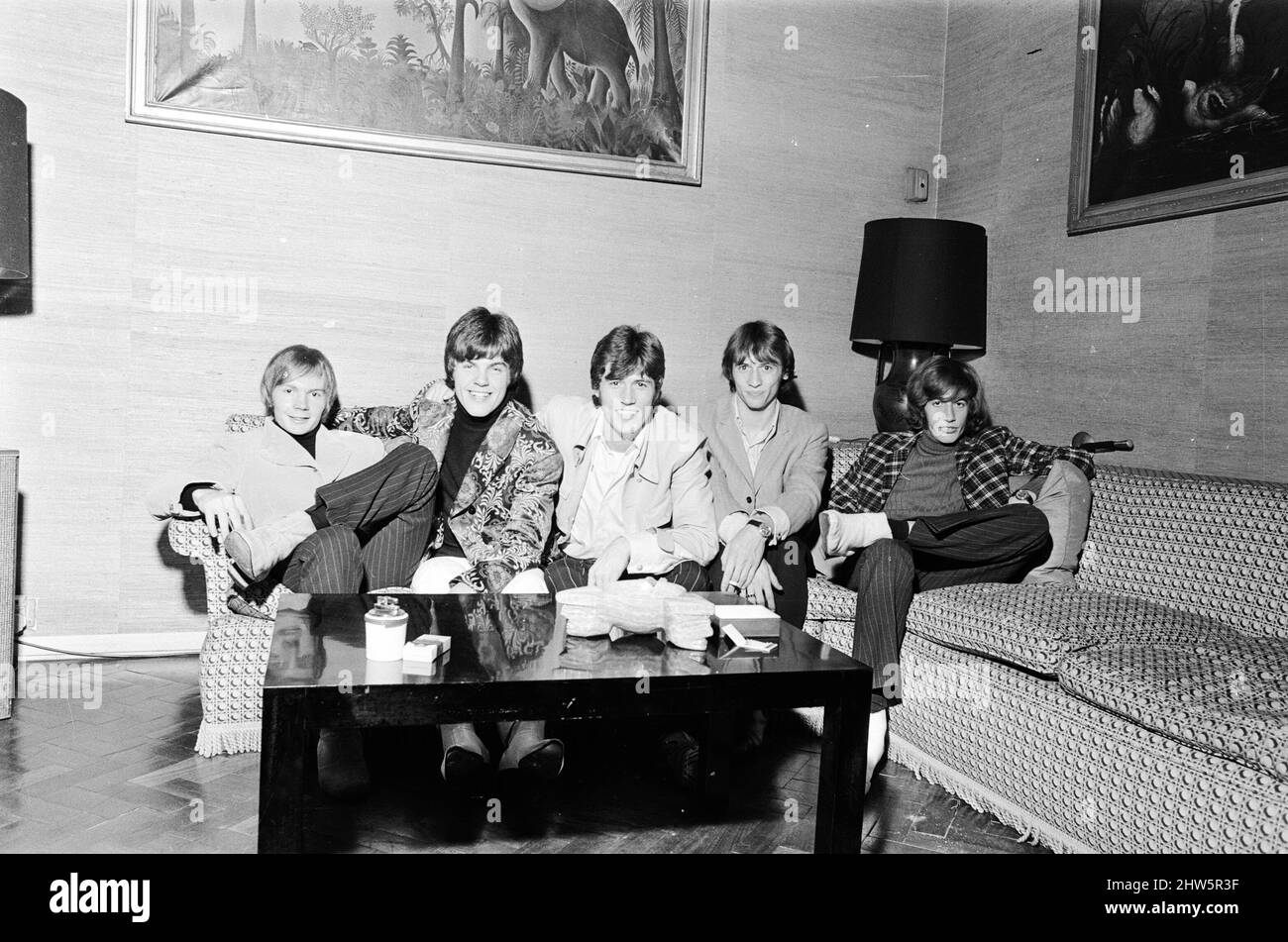 The Bee Gees seen here watching television in their hotel room 17th October 1967.   The Bee Gees is a 5 member group, comprising of Barry Gibb, Maurice Gibb, Robin Gibb, Colin Peterson & Vince Melouney *** Local Caption *** Colin Peterson  Vince Melouney Stock Photo