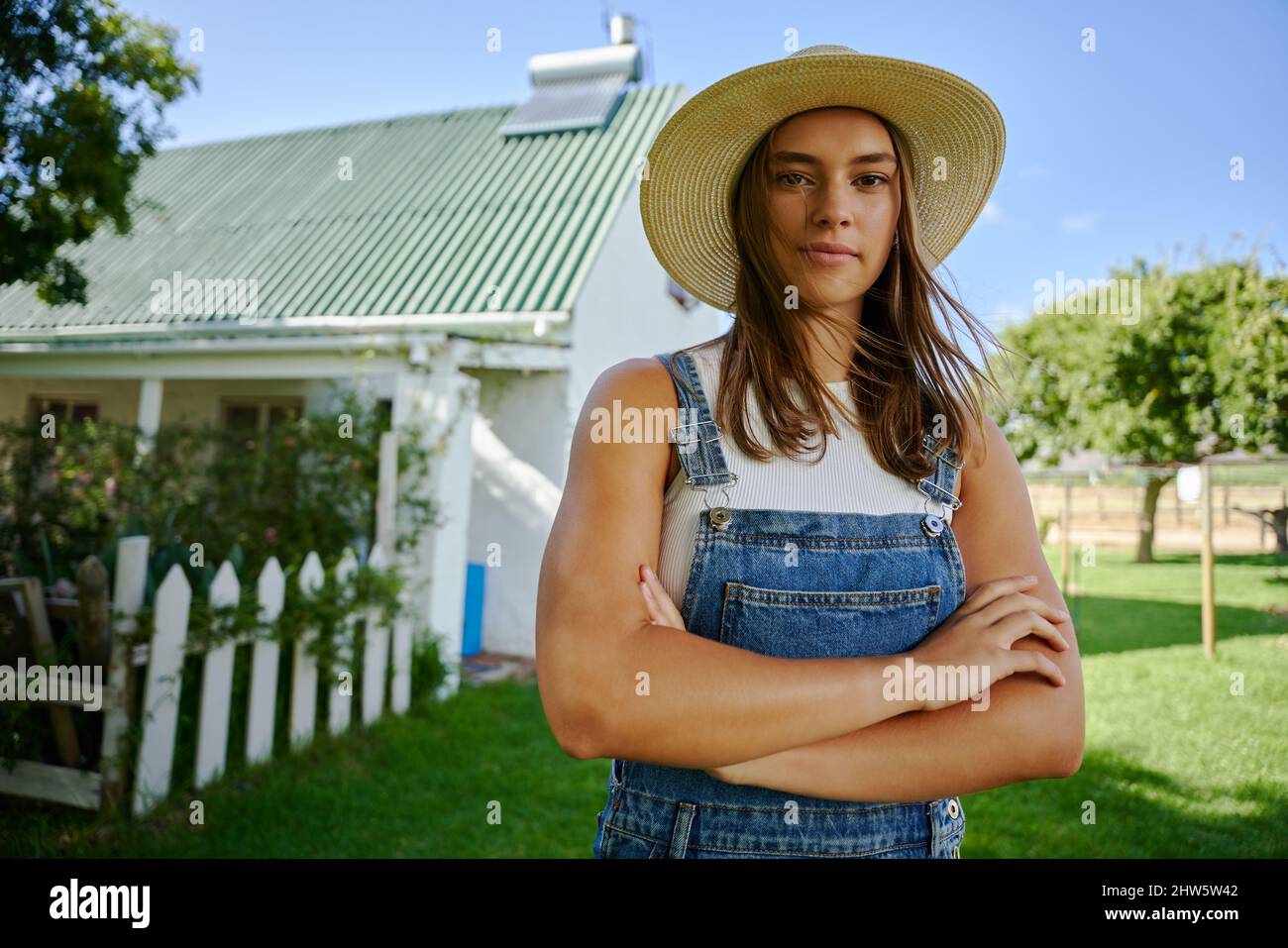 Caucasian female farmer standing outdoors with arms crossed Stock Photo ...