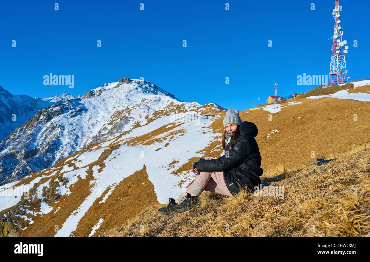 Tourist girl sits on mountain hi-res stock photography and images - Alamy