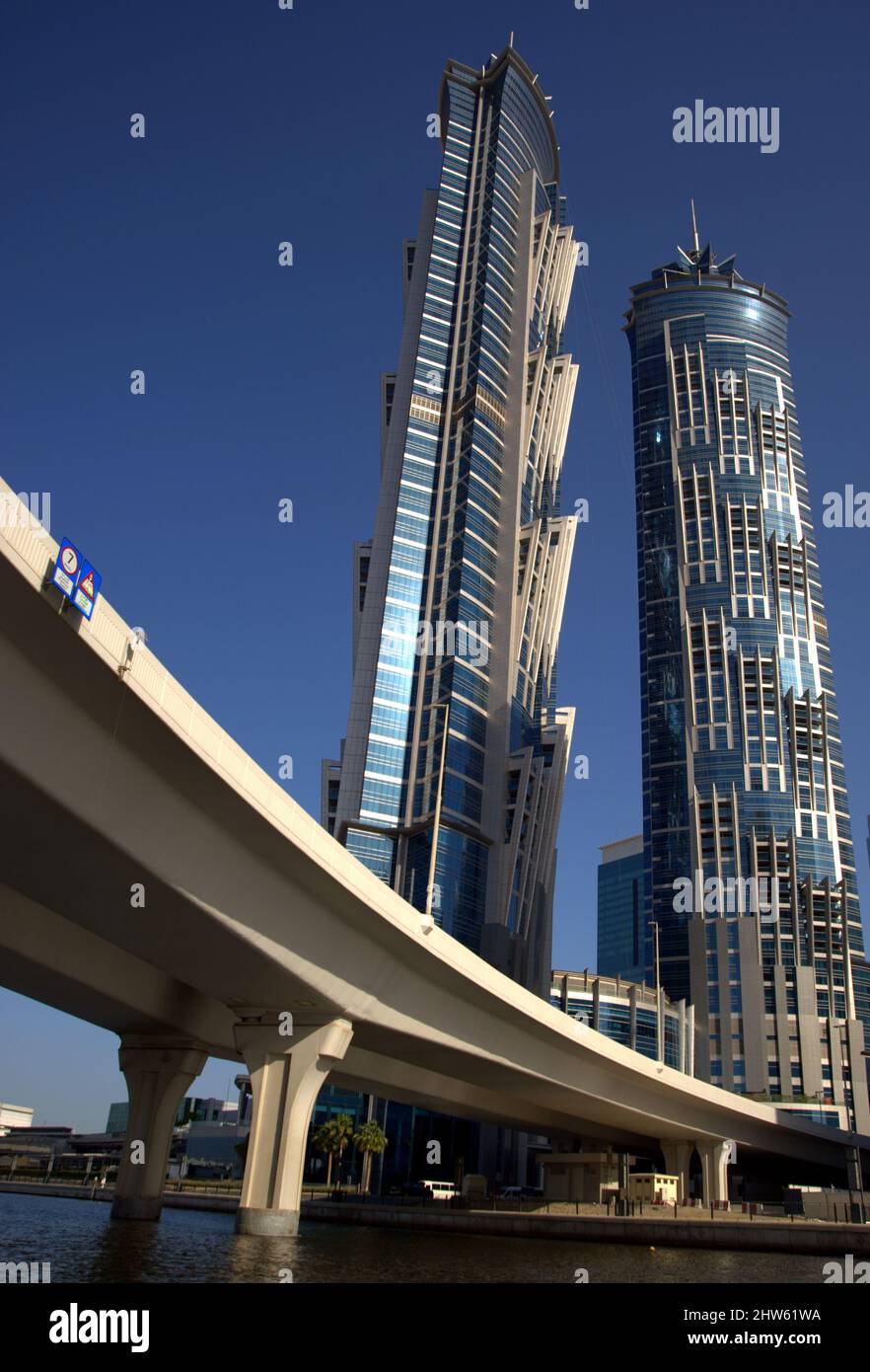 Vertical shot of two towers of the JW Marriott Marquis hotel under blue