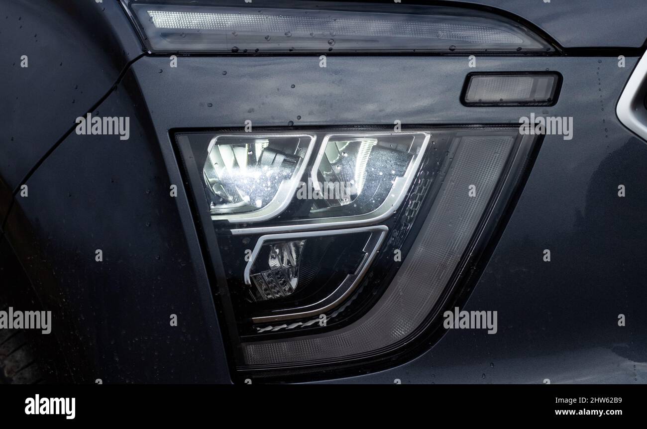 Exterior of a new car. Front LED low beam and high beam headlights