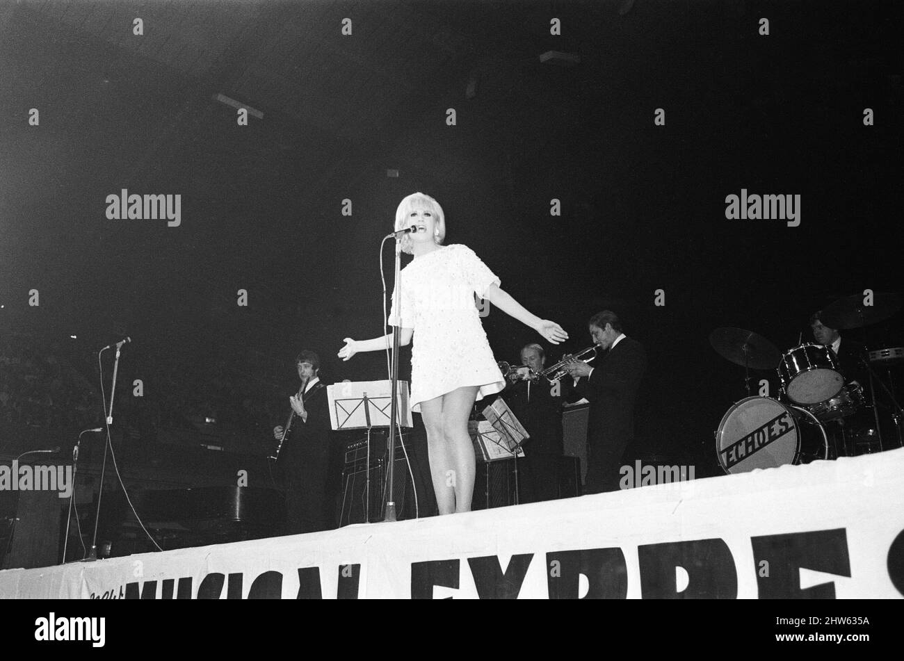 Dusty Springfield sings at The New Musical Express Poll Winners All Star Concert at The Empire Pool Wembley. Taking place in Wembley Pool in London and compered by Jimmy Savile and DJ Simon Dee it saw 10,000 fans attending the Poll Winners show. It lasted for three and a half hours and featured star turns from the likes of The Beach Boys, The Small Faces, Dusty Springfield, Cat Stevens, ('giant placards in the audience bearing 'CAT IS THE GREATEST' were evidence of his wide appeal,' we noted), Cliff Richard (who apparently 'got things going,'), The Troggs and Cream   Presenter Jimmy Saville  W Stock Photo