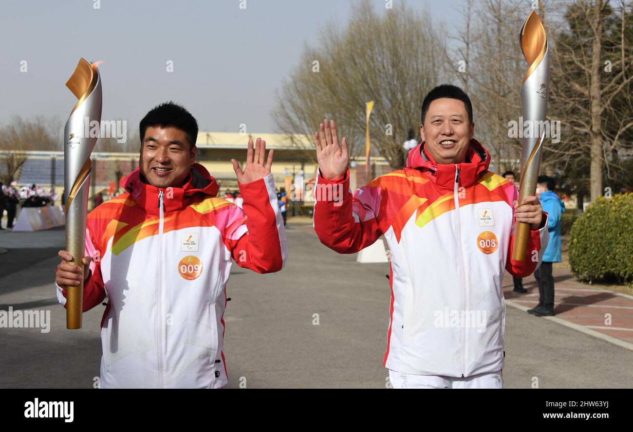 Beijing, China. 4th Mar, 2022. Torchbearers Ren Gaoqi (L) and Zhou Hongfei attend the Beijing 2022 Paralymic Torch Relay in Beijing, capital of China, March 4, 2022. Credit: Li Xin/Xinhua/Alamy Live News Stock Photo