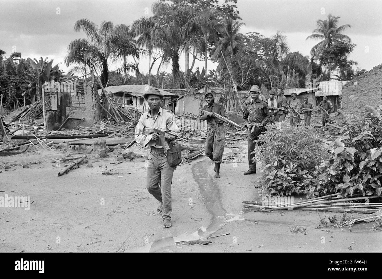 Biafran soldiers seen here advancing towards the Nigerian army during the Biafran conflict. 11th June 1968  The Nigerian Civil War, also known as the Biafran War endured for two and a half years, from  6 July 1967 to 15 January 1970, and was fought to counter the secession of Biafra from Nigeria. The indigenous Igbo people of Biafra felt they could no longer co-exist with the Northern-dominated federal government following independence from Great Britain. Political, economic, ethnic, cultural and religious tensions finally boiled over into civil war following the 1966 military coup, then  coun Stock Photo