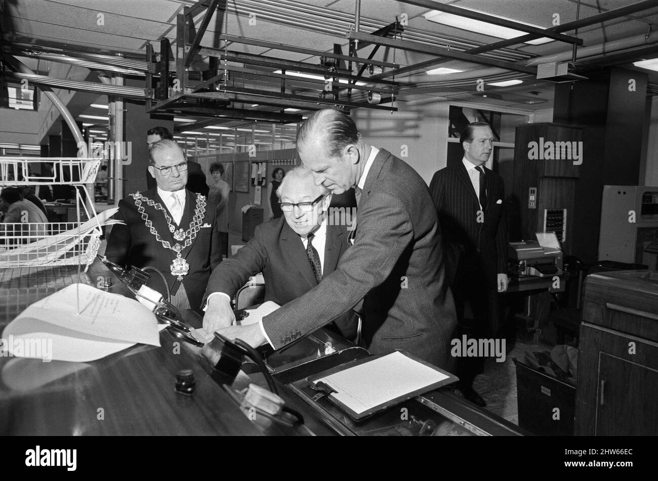 Prince Philip, Duke of Edinburgh, visiting the Birmingham Post and Mail offices. The Duke with Sir Eric and the Lord Mayor, Alderman James Stephen Meadows, in the wire room. 1st May 1968. Stock Photo
