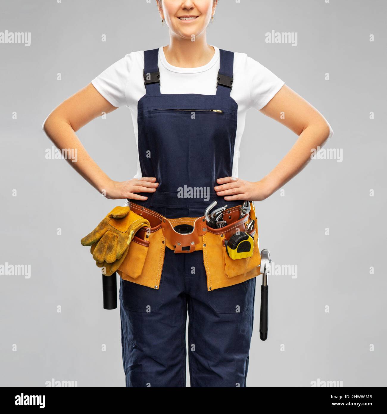 female worker or builder with working tools Stock Photo