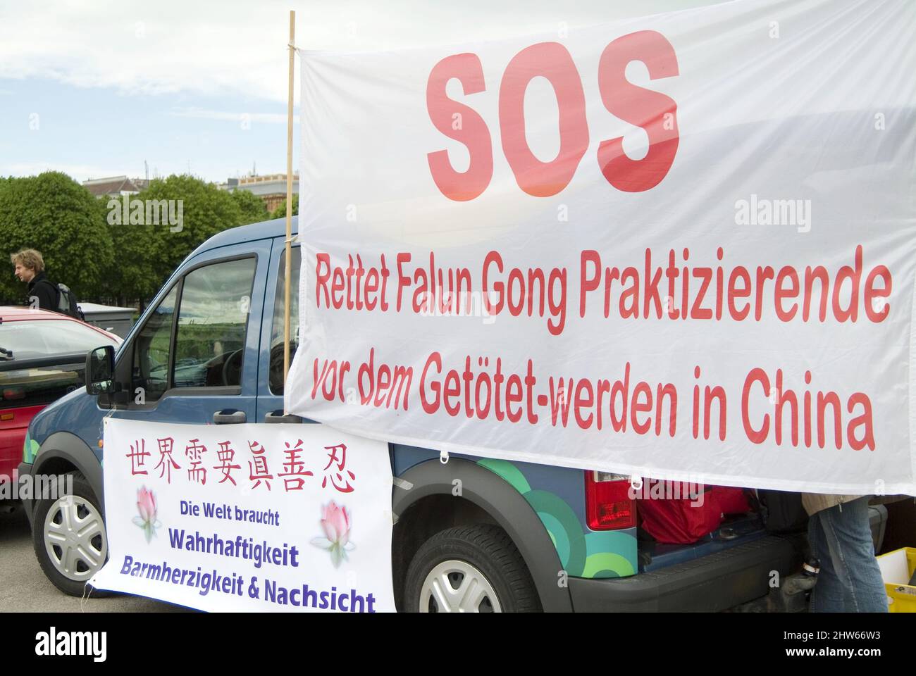 Vienna, Austria. July 12, 2006. Falun Dafa demonstration in Vienna. Inscription 'Save Falun Gong practitioners from being killed in China'. Stock Photo