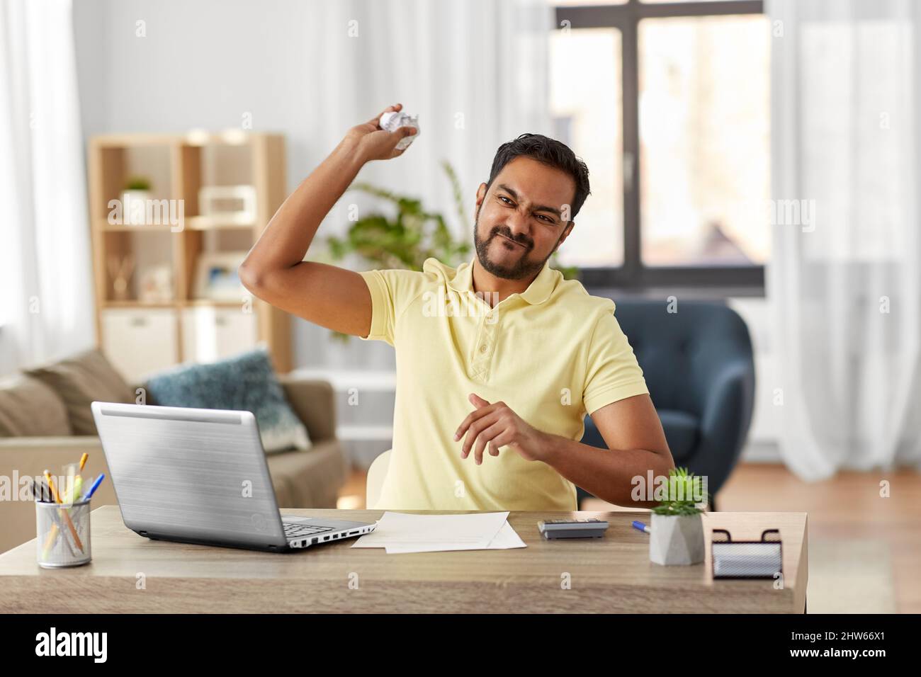 angry man throwing crumpled paper at home office Stock Photo - Alamy