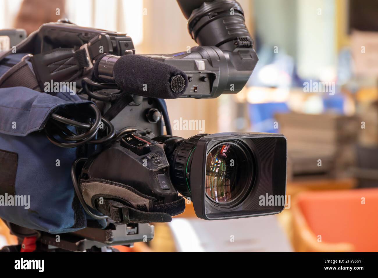 Professional TV video camera on a tripod. Close up. Selective focus Stock Photo