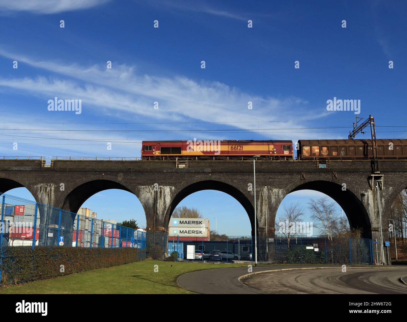 DB Cargo 66121 crosses the impressive and massive Ditton Viaduct with a freight train carrying imported aluminium as a nears the end of its trip Stock Photo