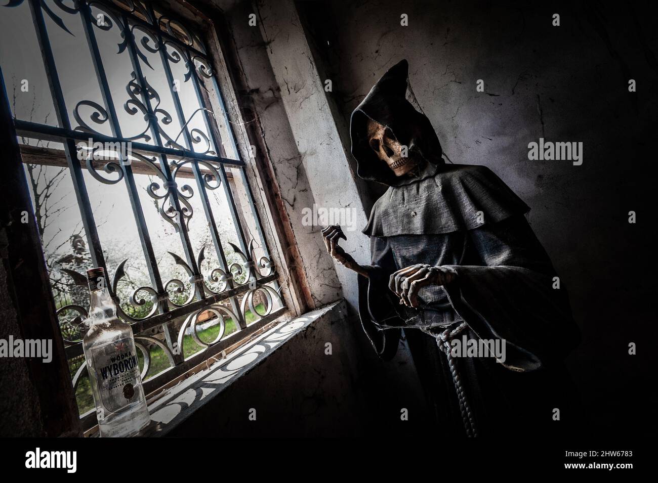November 2021, Urbex Italy, disturbing statue depicting death, in an abandoned house Stock Photo