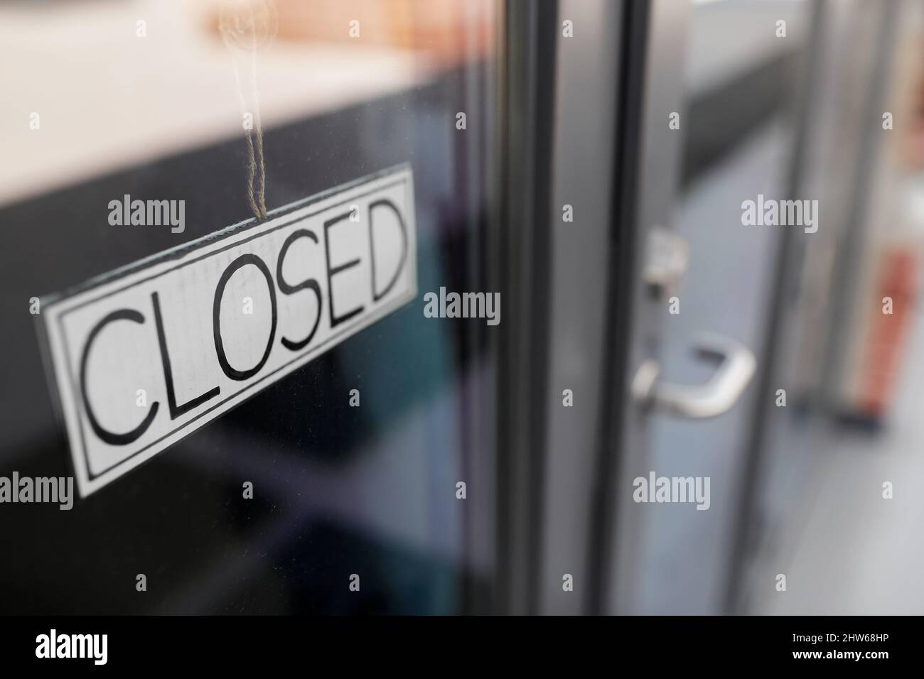 close up of closed sign on office door Stock Photo