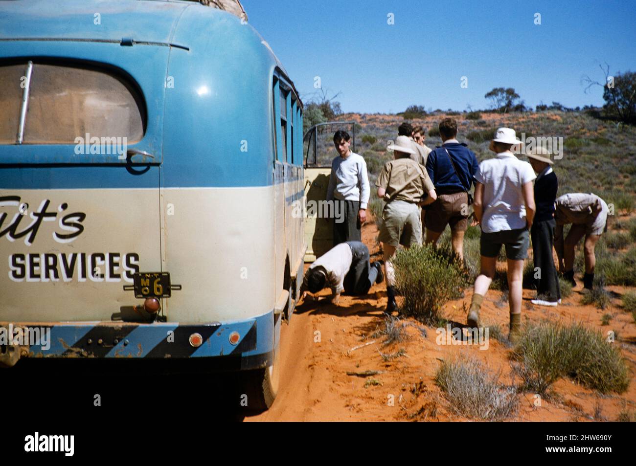 Melbourne Grammar School expedition, Northern Territory, Australia in 1956 tour bus operated by Len Tuit  on sandy unmade road track Stock Photo