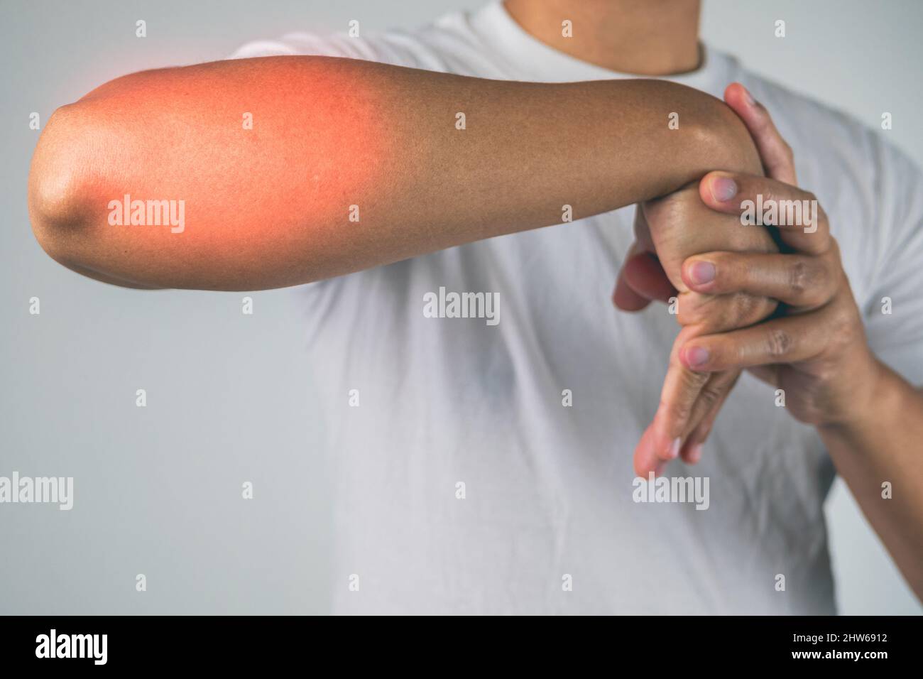 Elbow injury from tennis and golf. The man uses fingers to massage and