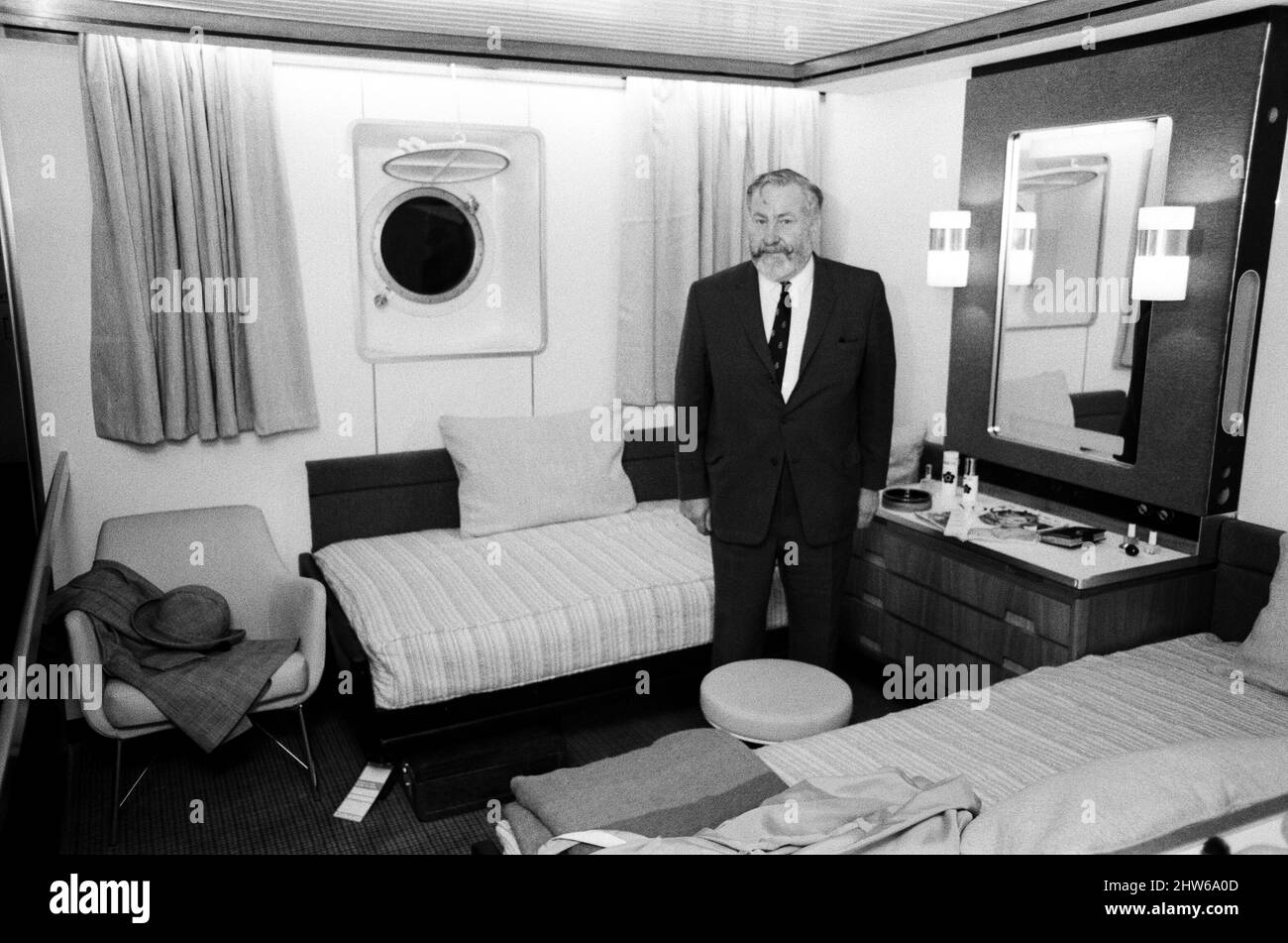 The Exhibition 'QE2 - A first look inside the new Cunarder' at The Design Centre. The exhibition gives the first general impression of some of the interior designs for the Queen Elizabeth 2, with full scale mock-ups cabins. Pictured, the new captain of the QE2, William Wawick, in a mock up of a typical tourist class cabin. London, 20th February 1968. Stock Photo