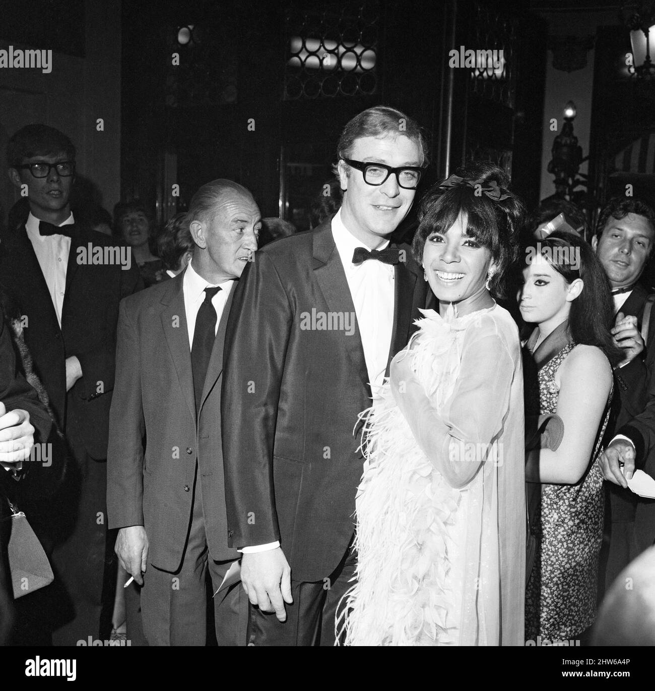 Michael Caine with Shirley Bassey at the premiere of the film Hurry Sundown at the Plaza.24th August 1967. Stock Photo