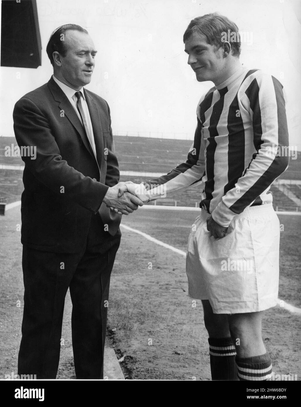 Tony Waddington Stoke City Manager shakes hands with new signing John Mahoney 9th September 1967. *** Local Caption *** Football Player Stock Photo