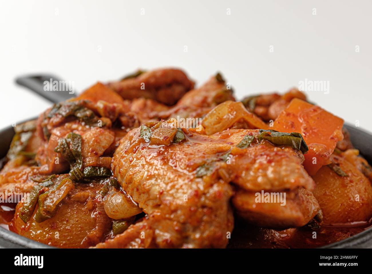 Braised Spicy Chicken on a white background Stock Photo