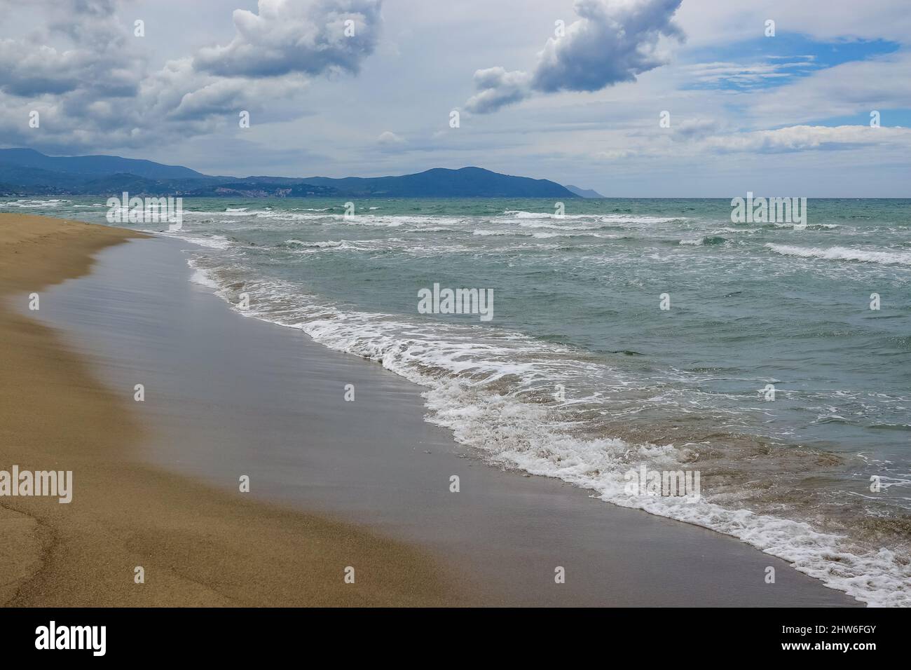 Aerial view of the beach under cloudy skies Stock Photo - Alamy