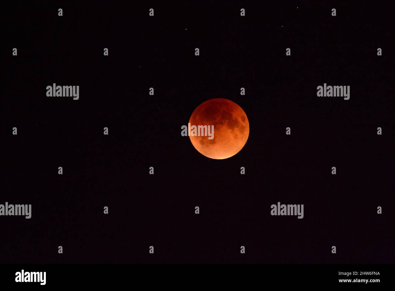 Super full blood moon with total lunar eclipse on dark sky Stock Photo ...