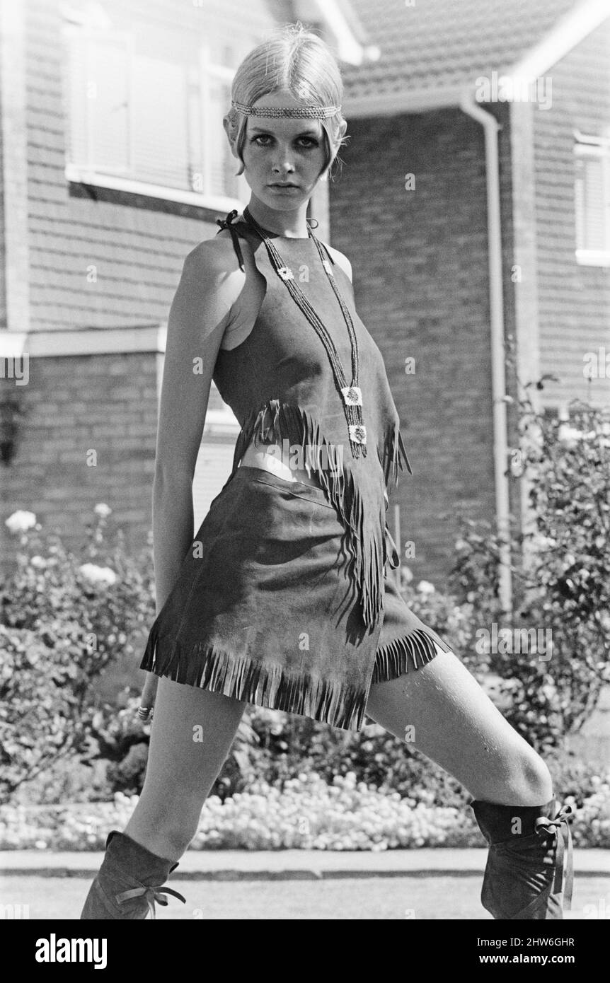 Twiggy, (real name Lesley Hornby) English model, seen in a Hippie gear outfit.  Pictured before she left for the New York, America, USA later the same day. Twiggy said of her Hippie outfit, "I Love it !   I have a Hippie hat, it's straw with poppies on the side.  But I couldn't wear it today because it doesn't go with this outfit.  That shows I'm not a real Hippie doesn't it ?  If I was, I'd wear it anyway wouldn't I ? " she goes on to say "I think the clothes can be adapted to everyday wear, we're certainly planning some for the next Twiggy range"  Picture taken 21st August 1967 Stock Photo