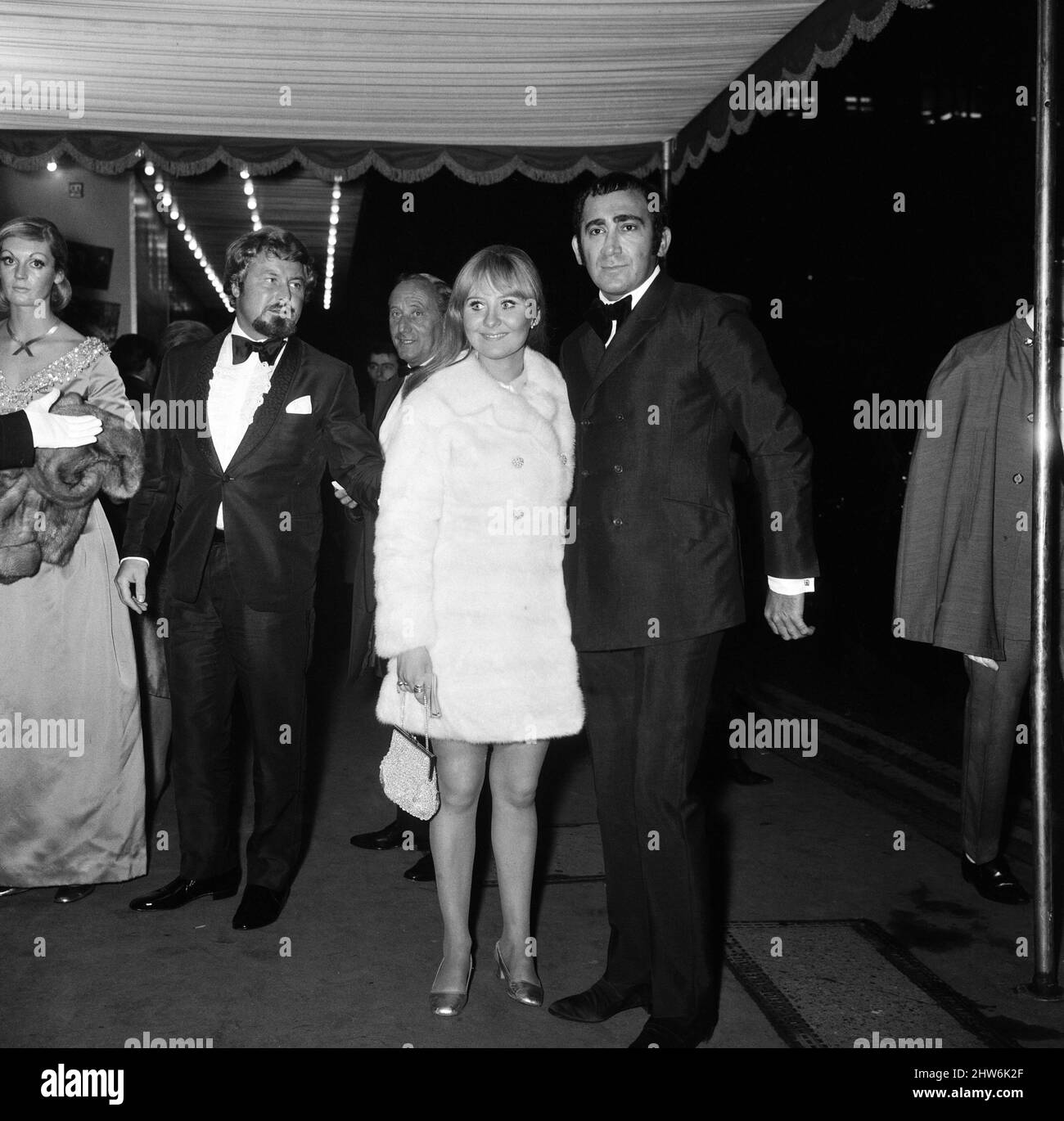 The Royal Charity Premier of 'Oliver!' in the presence of HRH Princess Margaret and Lord Snowdon, in aid o the NSPCC, sponsored by the Variety Club. Singer Lulu arrives at the Odeon with Lionel Bart, writer and composer of the film. Odeon Theatre, Leicester Square. 26th September 1968. Stock Photo