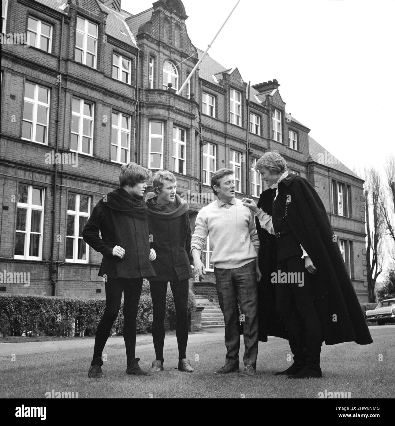 British actor and singer Gary Miller with his three children Jonty (left), Kit (2nd left) and Pip (right) outside Alleyn's School in Dulwich, before their production of the famous Shakespeare play 'Hamlet'.12th March 1967. Stock Photo