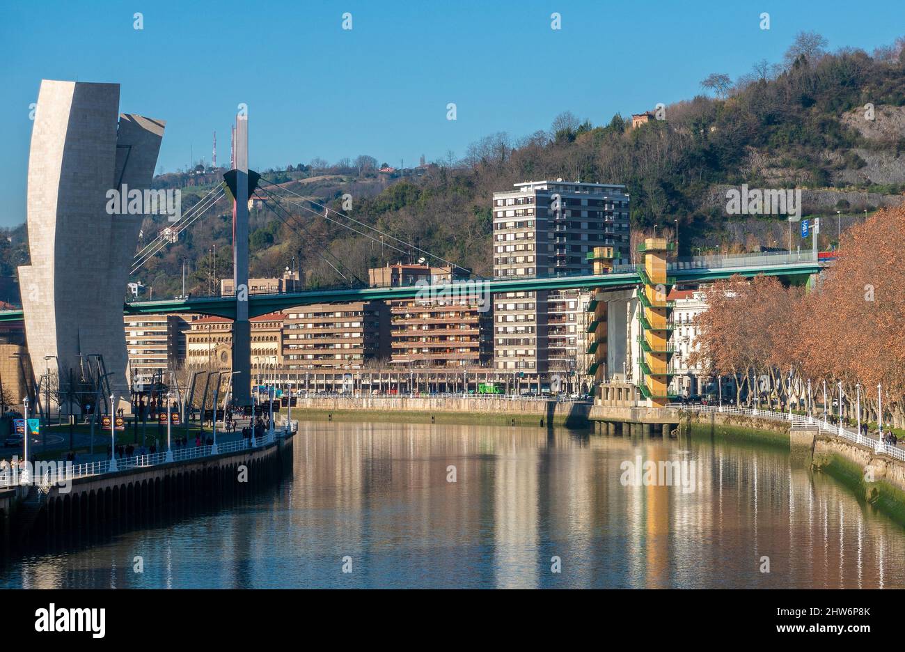View down the Nervion River towards the Salbe zubia / puente de La Salve bridge, located next to the Guggenheim Museum in Bilbao, Spain Stock Photo