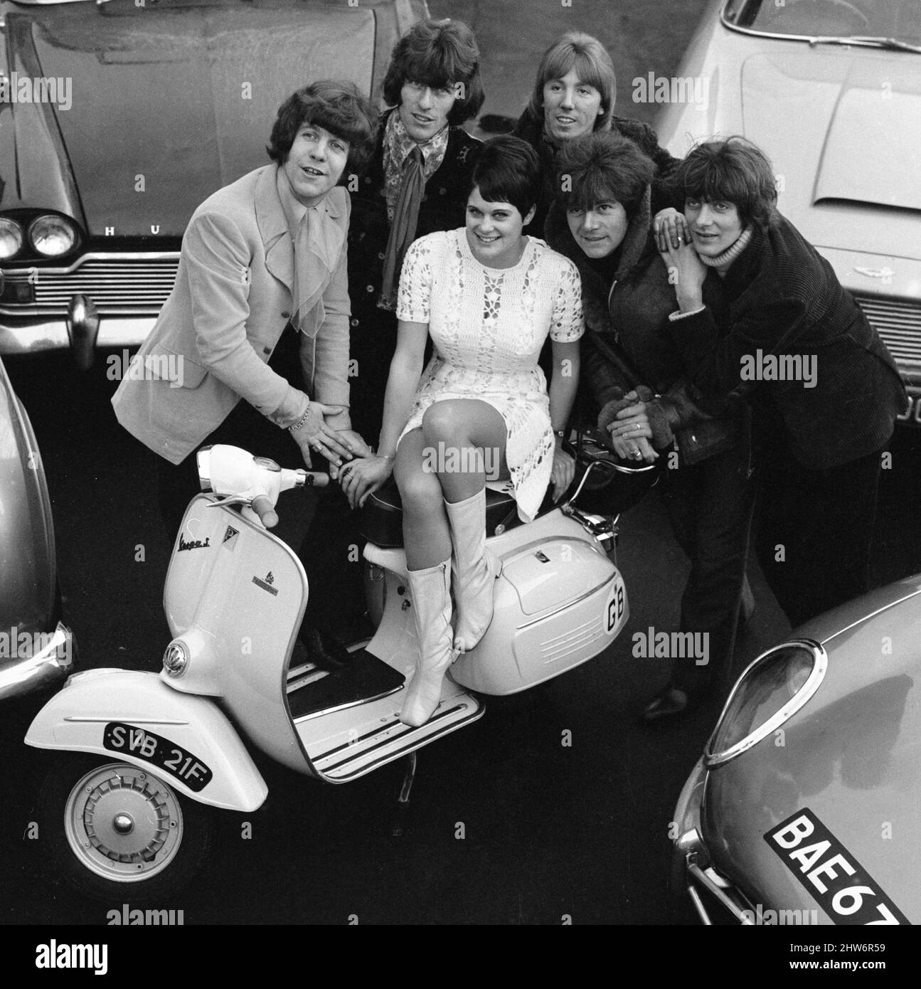 Car owners Dave Dee, Tich, Beaky and Mick surround Dozy and his girfriend 20 year old Ann Bridger on their scooter. December 1st 1967 X11130 Stock Photo