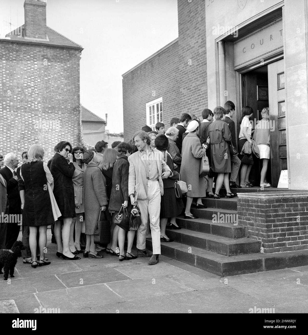 Members of the public filing into court to see Mick Jagger and Keith