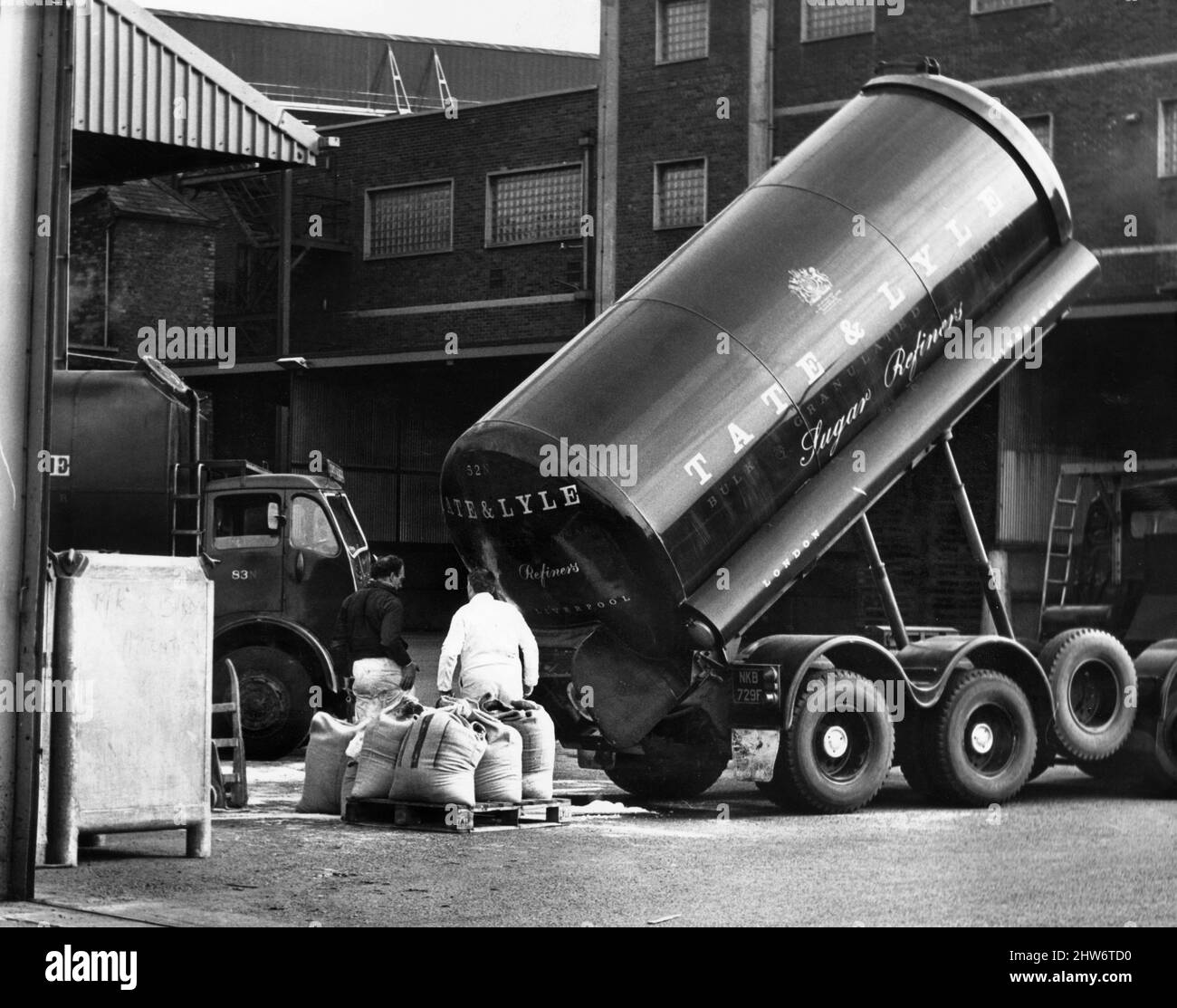 Work in progress at the Tate and Lyle sugar refinery in Love Lane near the docks in Liverpool after haulage drivers returned to work.8th April 1968. Stock Photo