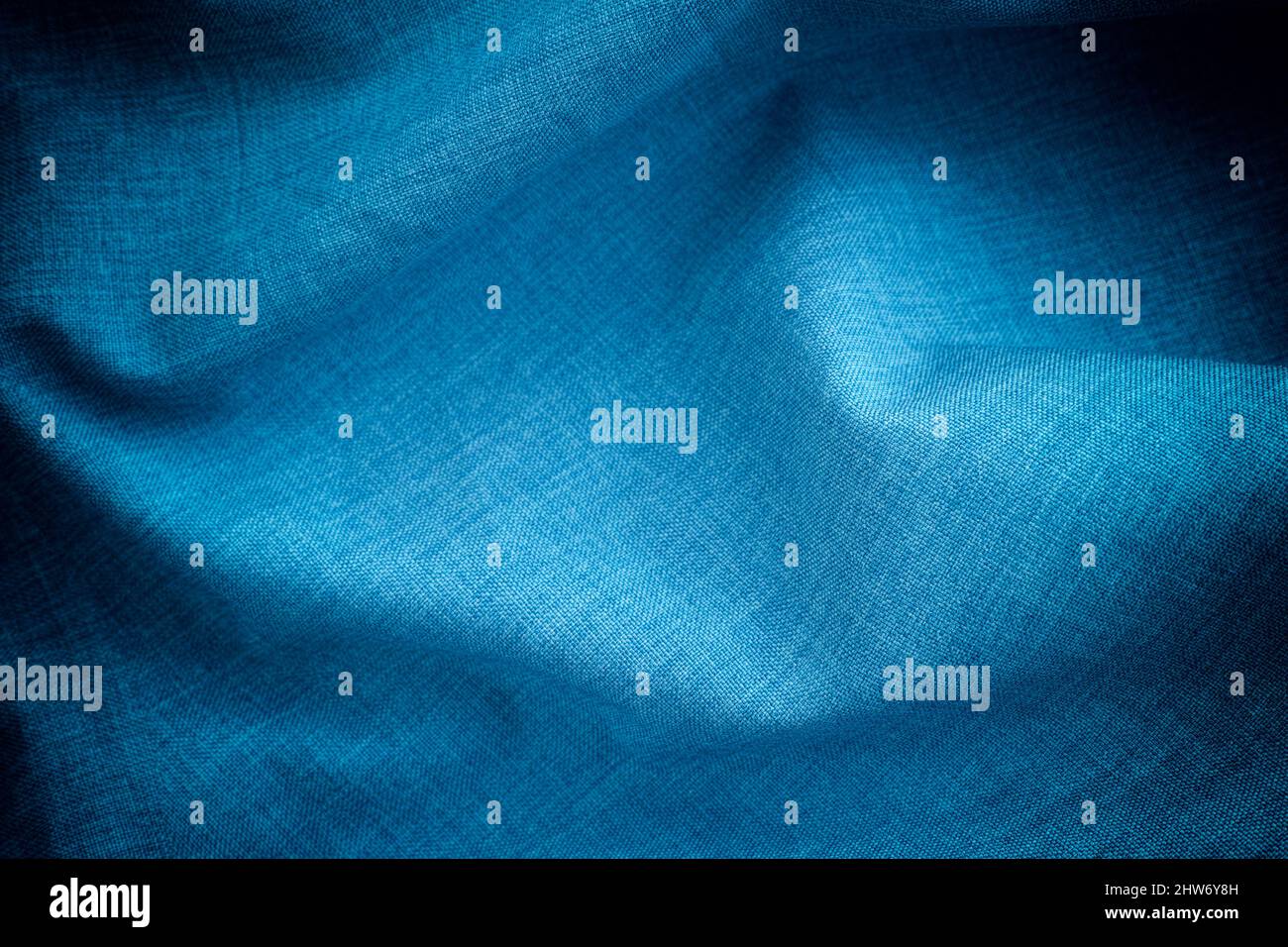 Dark blue crumpled fabric background. Close up. Stock Photo