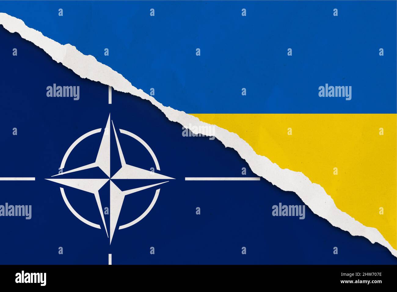 Ukraine and NATO flag ripped paper grunge background. Abstract Ukraine and NATO politics conflicts, war concept texture background Stock Photo