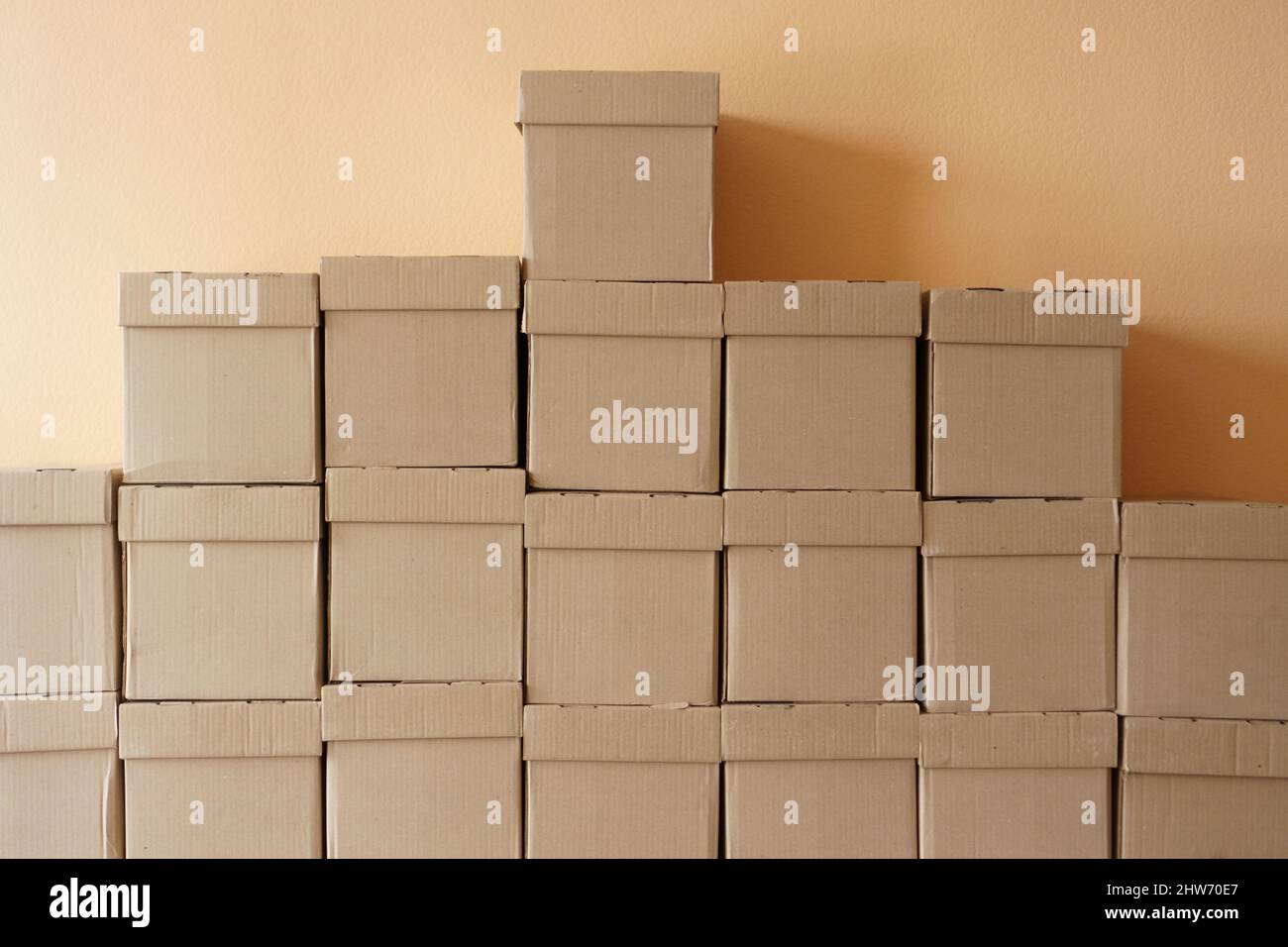 Set of cardboard brown boxes in storehouse. Background of carton boxes