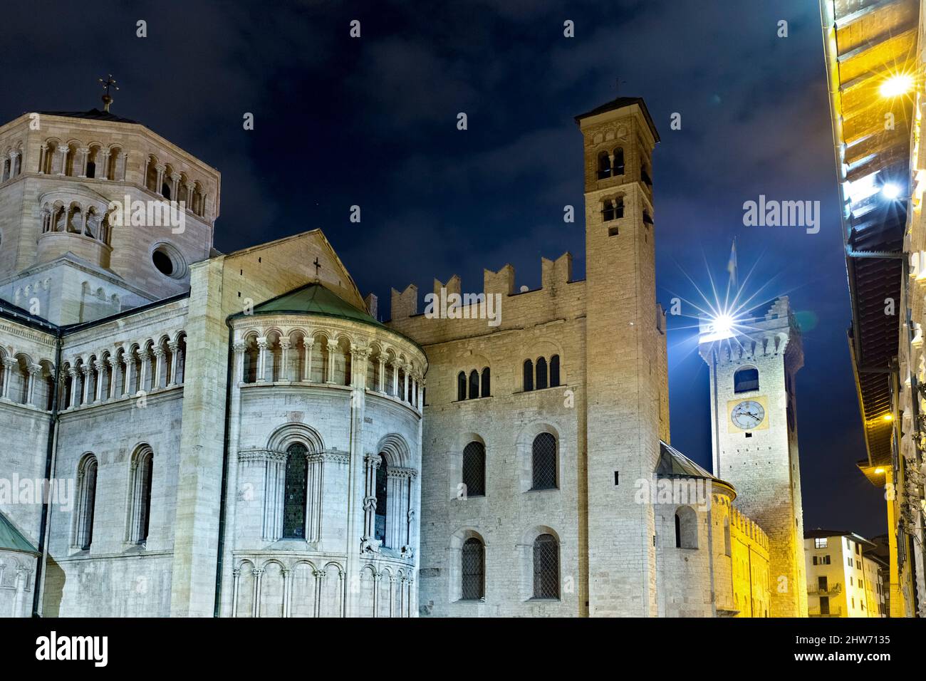 Trento by night: the 'Castelletto dei Vescovi' (bishops' castle) and the apse of the cathedral. Trentino Alto-Adige, Italy, Europe. Stock Photo