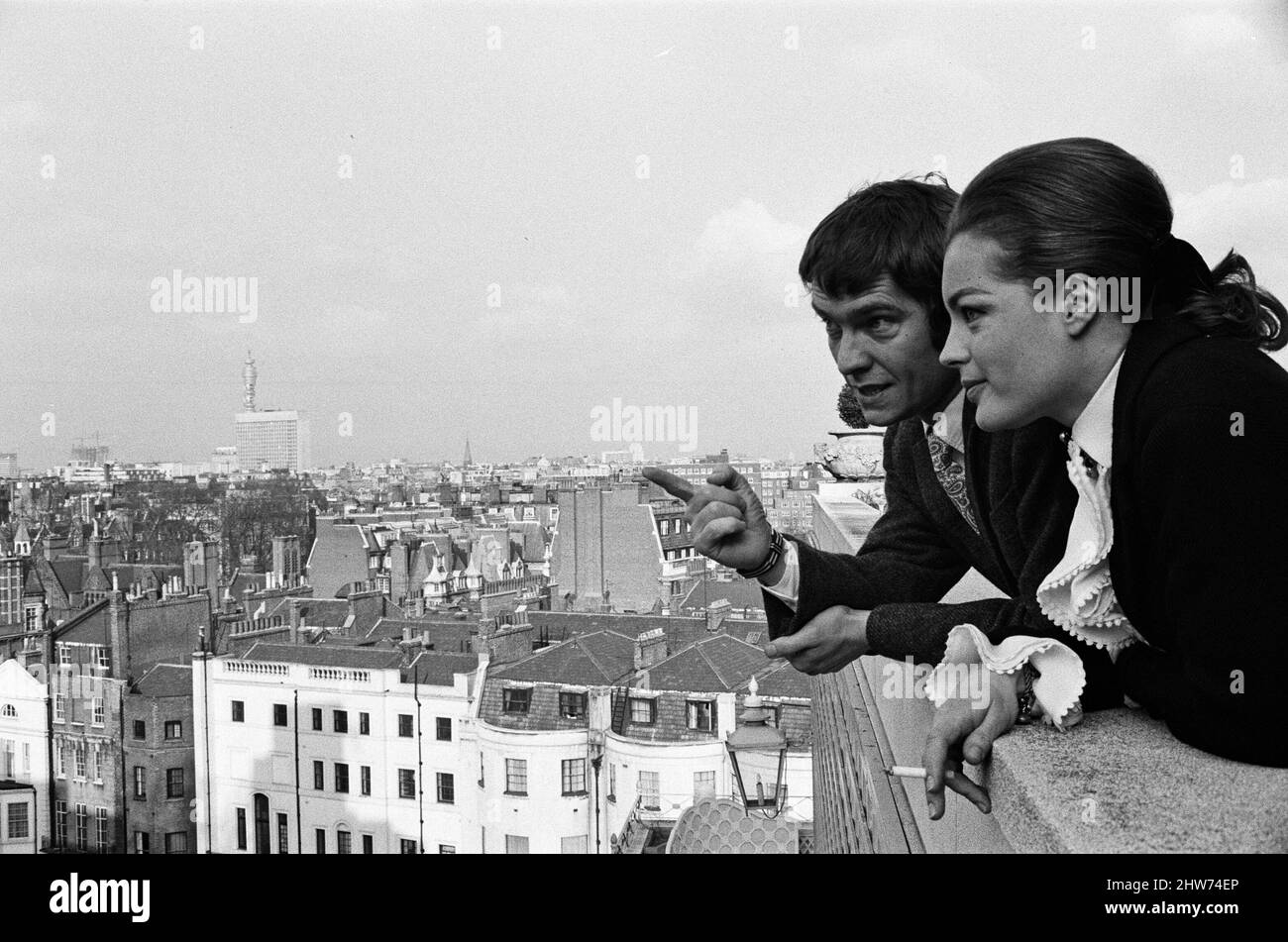 Tom Courtenay and Romy Schneider at the Dorchester Hotel looking at some of the places where they will be filming their new thriller 'Otley' in London. 3rd March 1968. Stock Photo