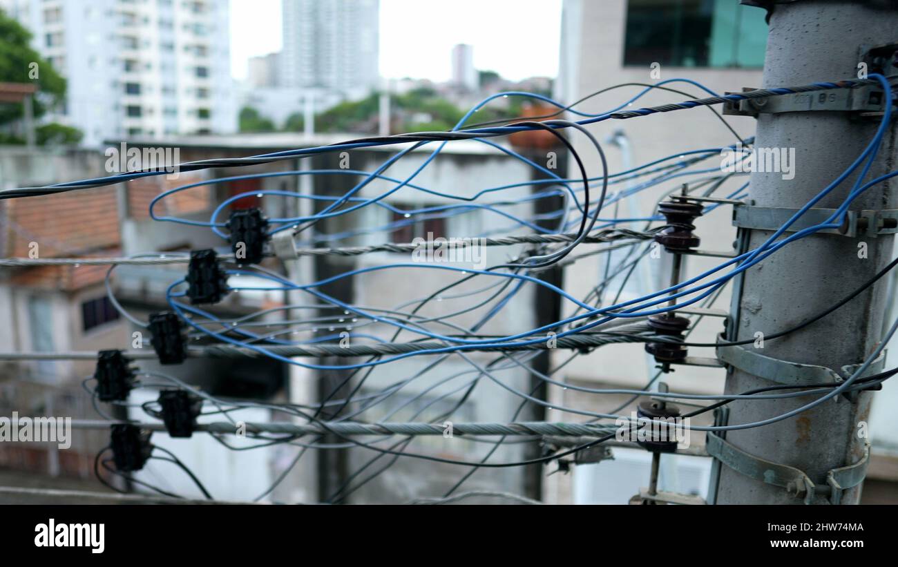 Electric pole with wires in third world country Stock Photo - Alamy