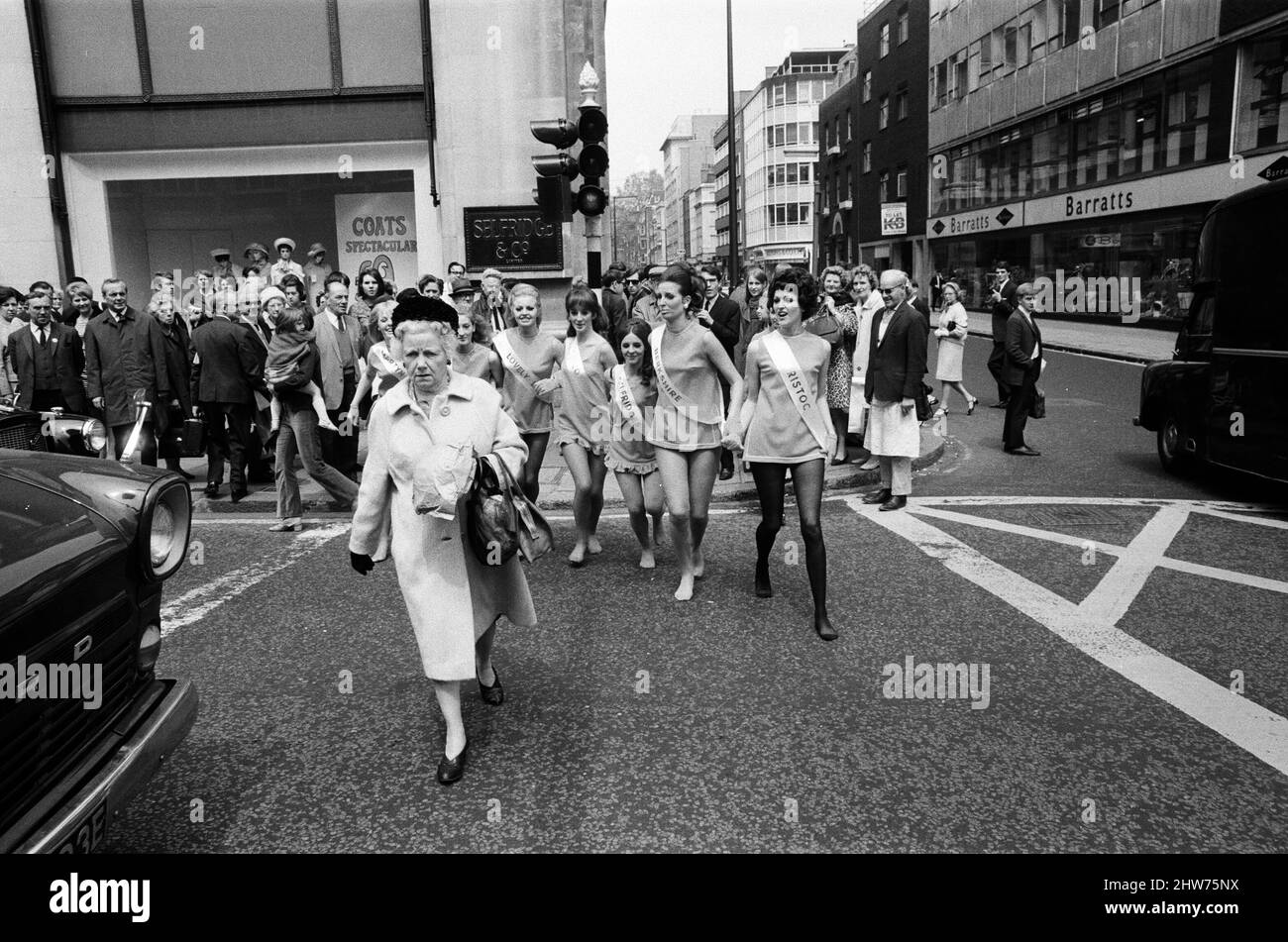 London stores are holding a shopping festival, the 'Britain is Great' exhibition. In Selfridges there was a 'charge of the tight' brigade' where seven lovely ladies with lovely legs appeared representing famous hosiery manufacturers.  The girls walking down Oxford Street. 23rd May 1968. Stock Photo