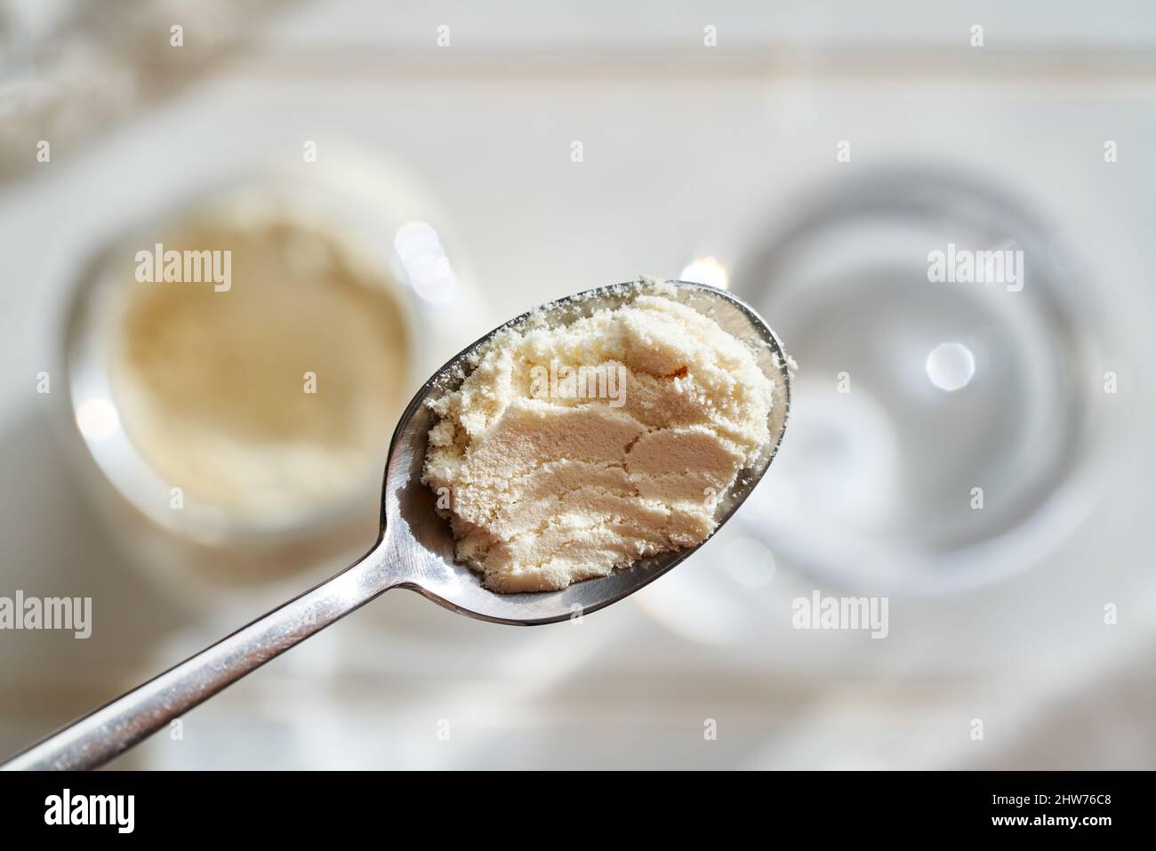 Whey protein powder on a metal spoon healthy nutritional supplement Stock Photo Alamy