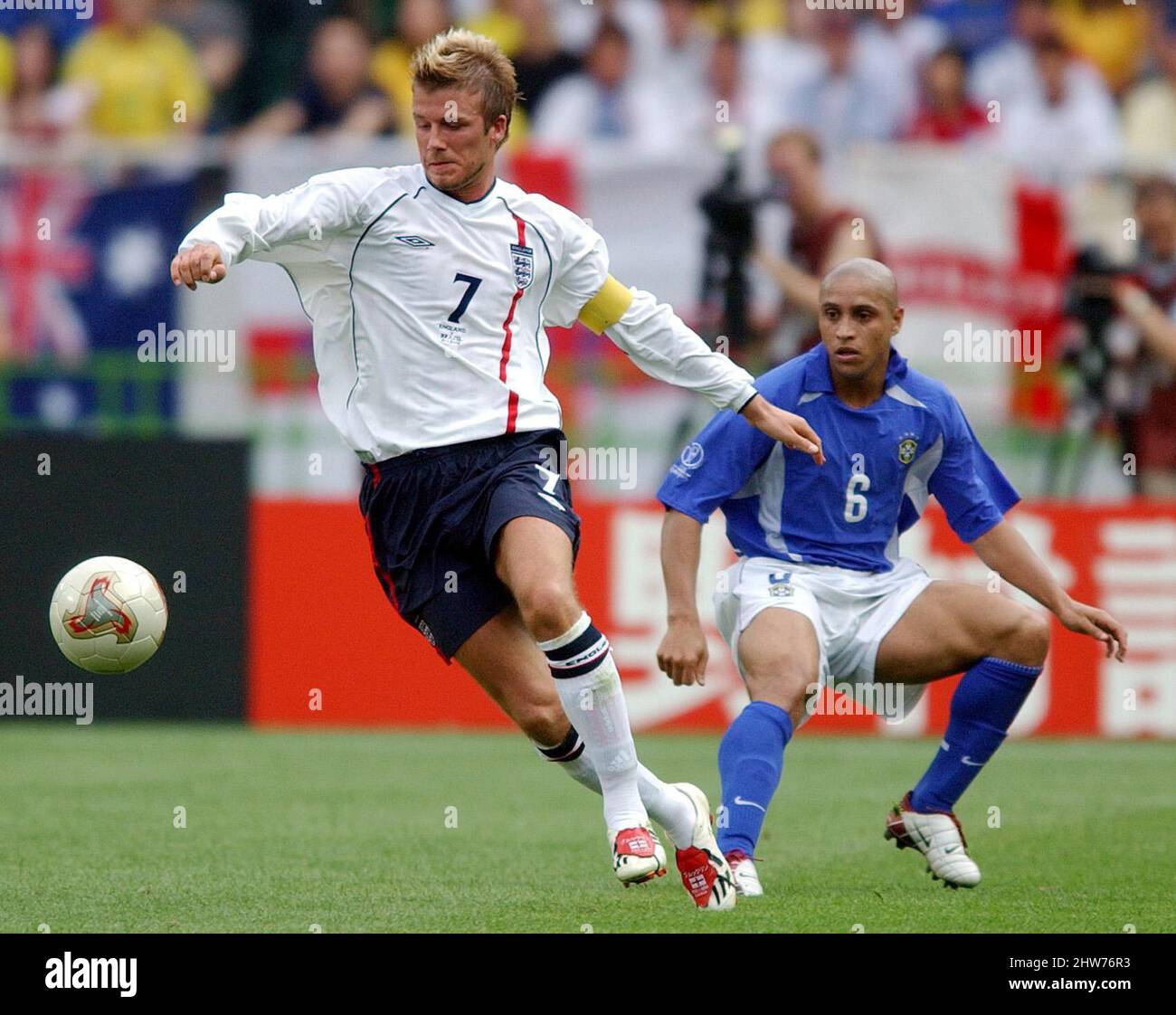 File photo dated 21-06-2002 of England's David Beckham (left) goes past Roberto Carlos of Brazil. World Cup-winning former Brazil defender Roberto Carlos will today get a taste of English Sunday league football after lining up for Shrewsbury side Bull in the Barne United. Issue date: Thursday March 4, 2022. Stock Photo