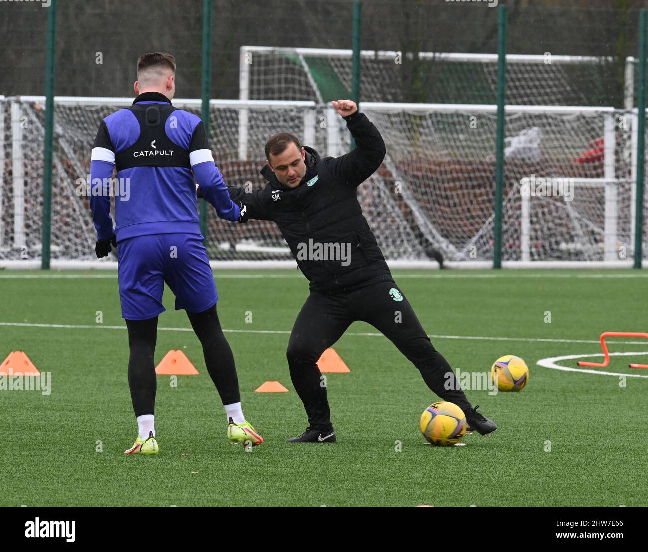 East Mains.Ormiston.Tranent.East Lothian.Scotland.UK.4th March 22 Hibs' Manager, Shaun Maloney & James Scott, training session for Cinch Premiership match with St Johnstone Credit: eric mccowat/Alamy Live News Stock Photo