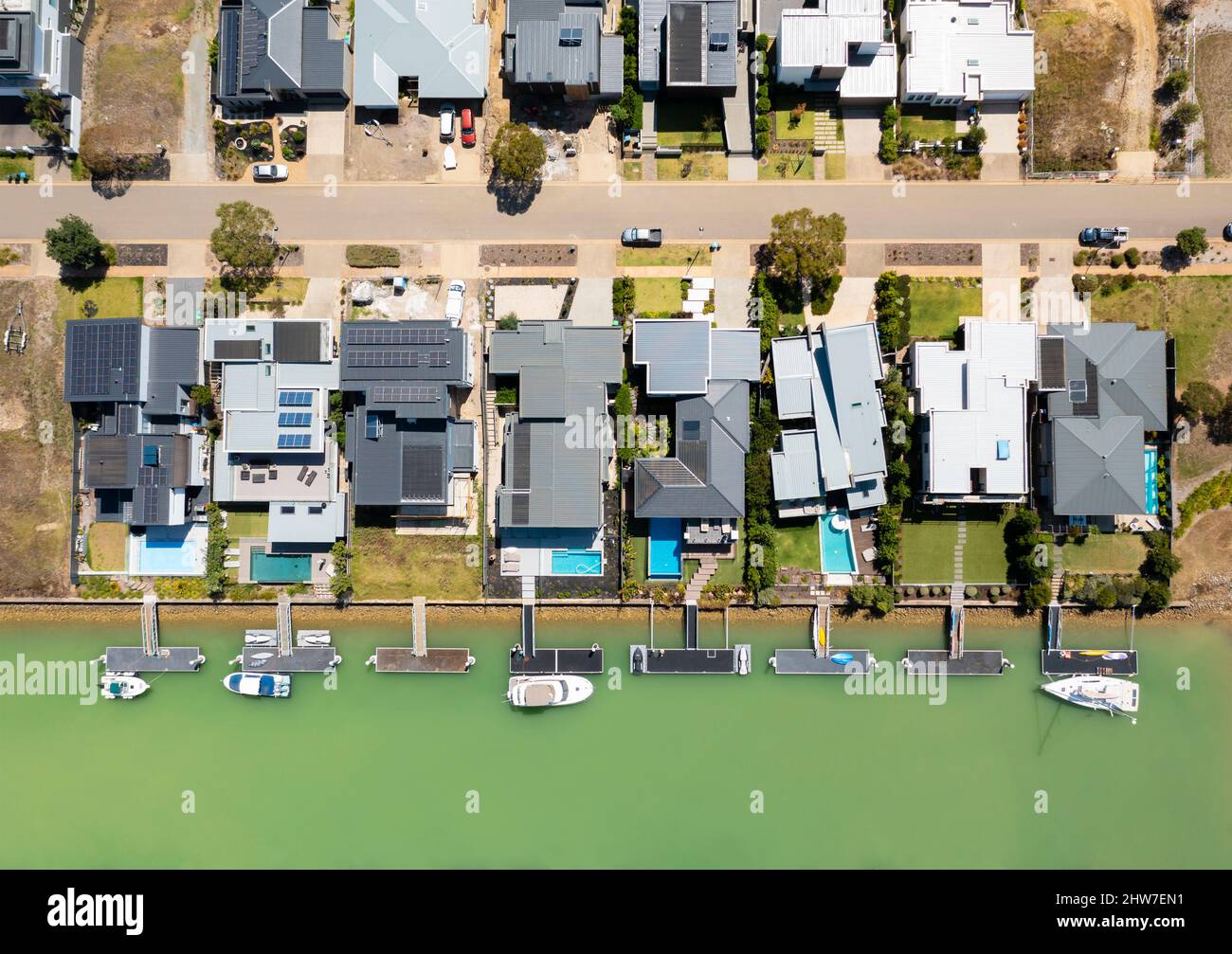 Aerial top down view of contemporary waterfront houses with berth in Melbourne Stock Photo