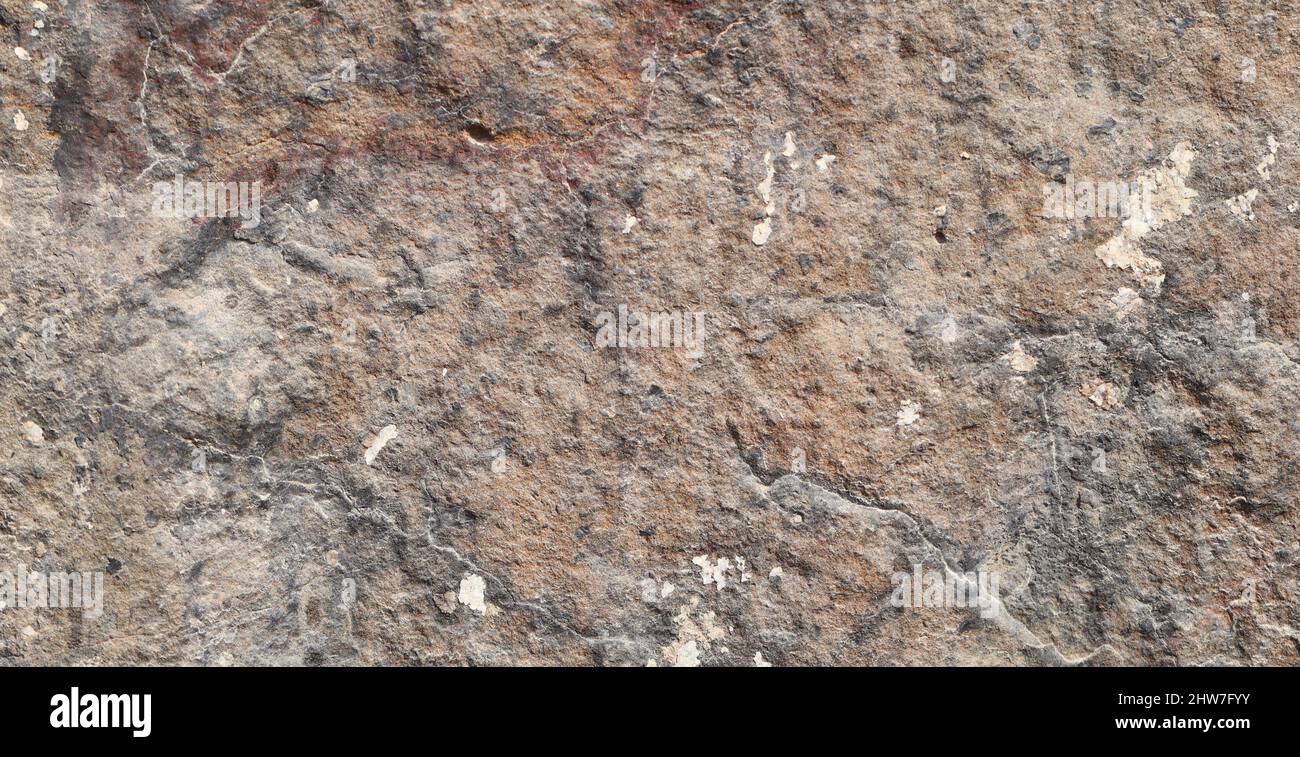 Brown colored stone detail texture abstract background. Stock Photo