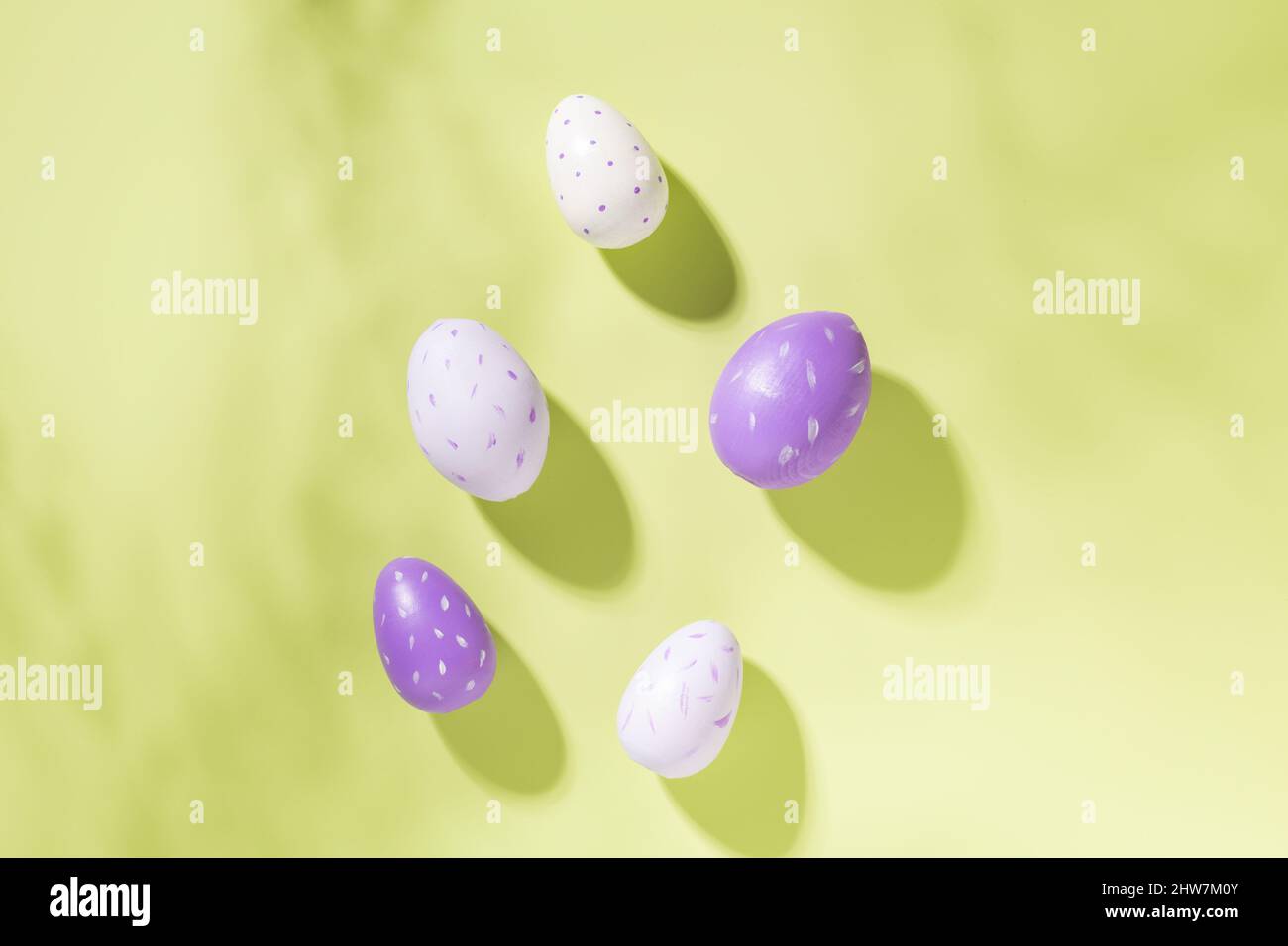 Multicolored easter eggs on green background. Easter concept. Top view. Copy space Stock Photo