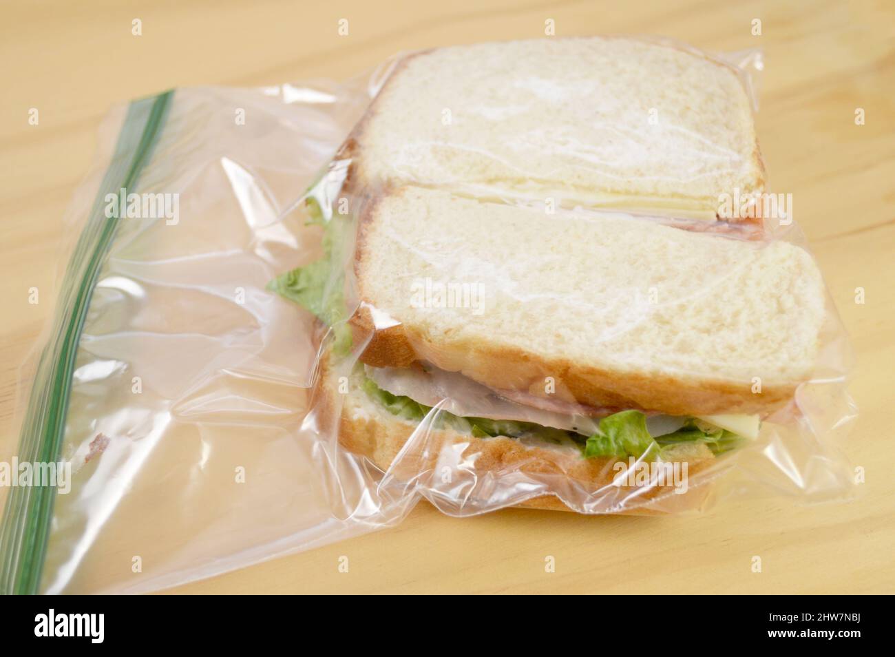 Ham Sandwich in a Plastic Bag to Take to School or Work for Lunch Stock Photo