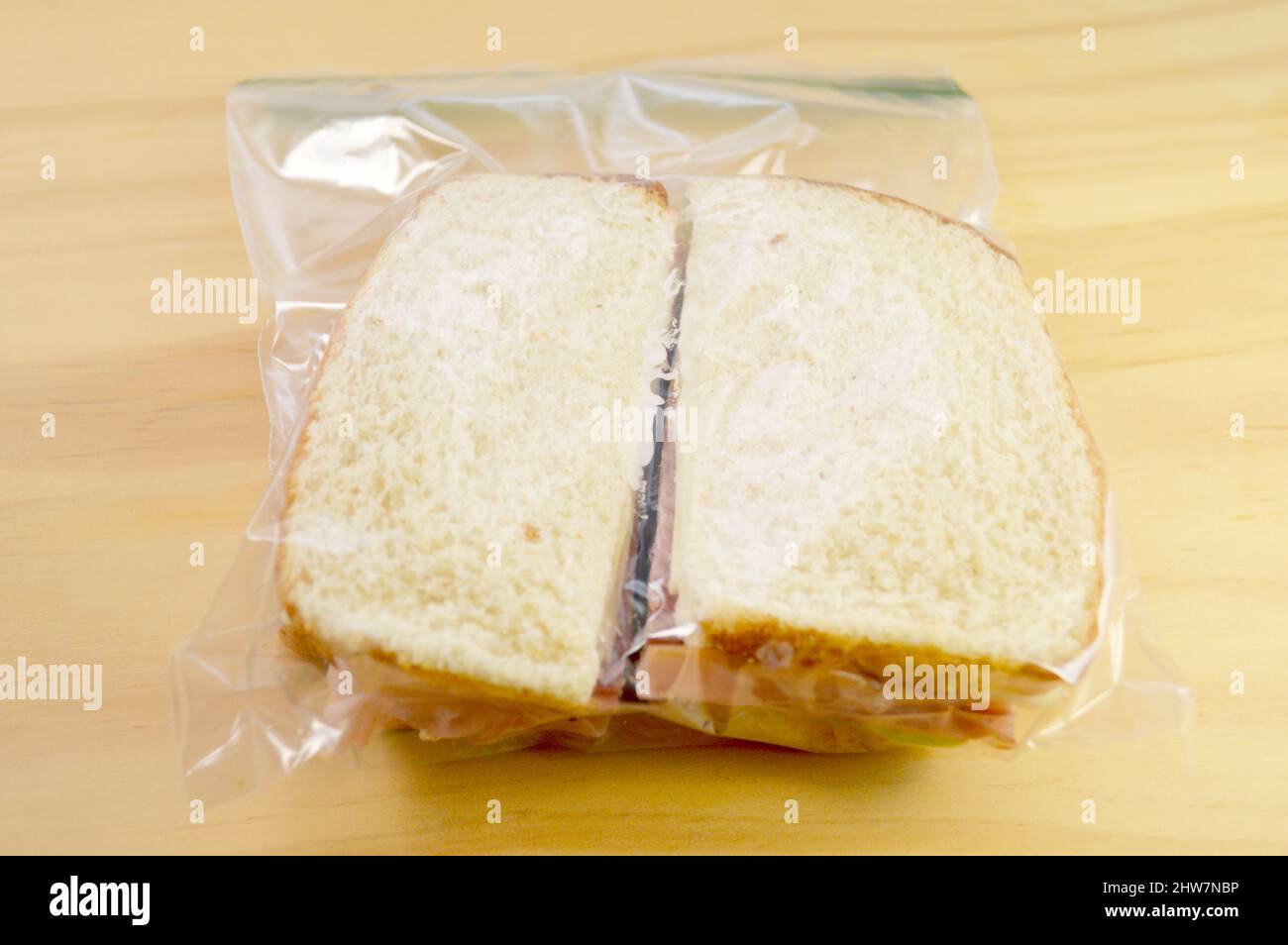 Ham Sandwich in a Plastic Bag to Take to School or Work for Lunch Stock Photo