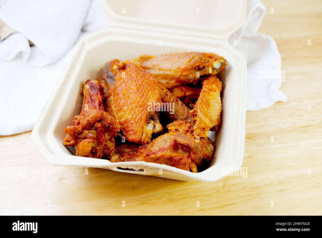 Finger Food Deep Fried Chicken Wings in a Takeout Container Stock