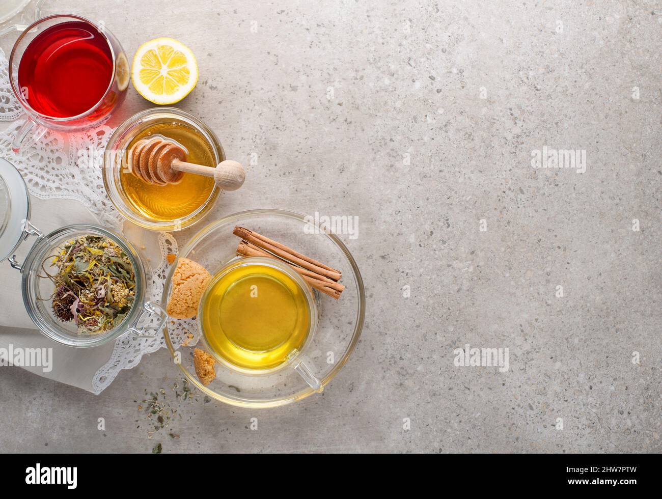 Herbal tea, green tea, fruit tea cups on grey background Stock Photo