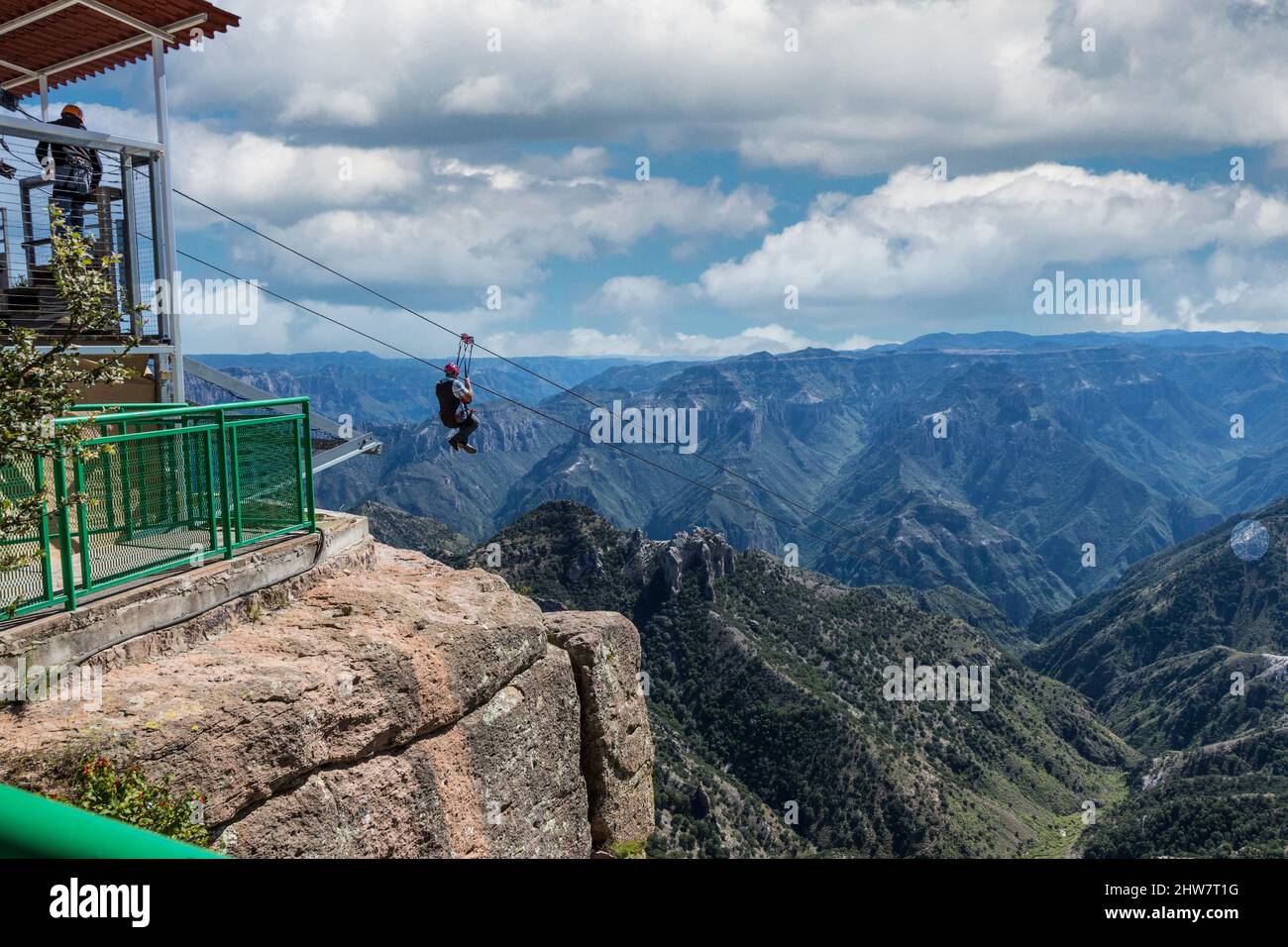 Ziplining at Divisadero, Copper Canyon, Chihuahua, Mexico. 8350 feet long, longest zip line in the world.  Speed may reach 70 mph on the descent. Zip Stock Photo